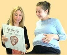 Nurse-Midwife Educating Expectant Mom